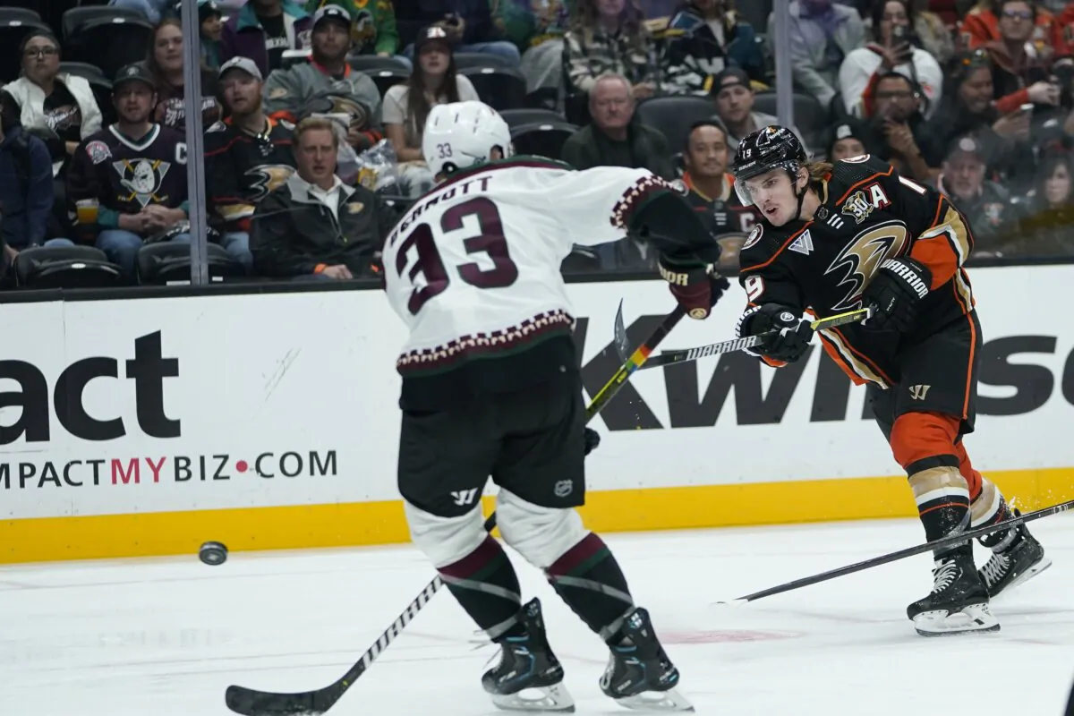 Anaheim Ducks right wing Troy Terry, right, shoots past Arizona Coyotes defenseman Travis Dermott for a goal during the first period of an NHL hockey game in Anaheim, Calif., on Nov. 1, 2023. (Ryan Sun/AP Photo)