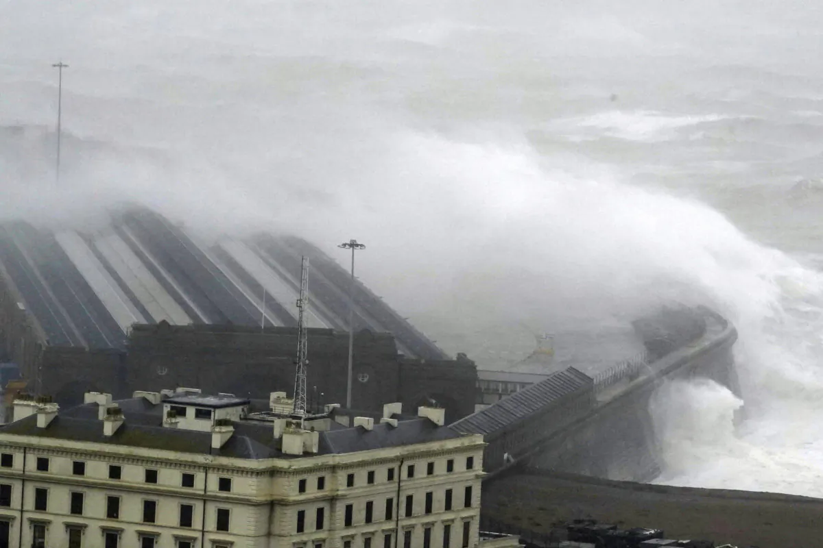Waves crash over the harbour wall as Storm Ciaran brings high winds and heavy rain along the south coast of England in Folkestone, England, on Nov. 2, 2023. (Gareth Fuller/PA via AP)