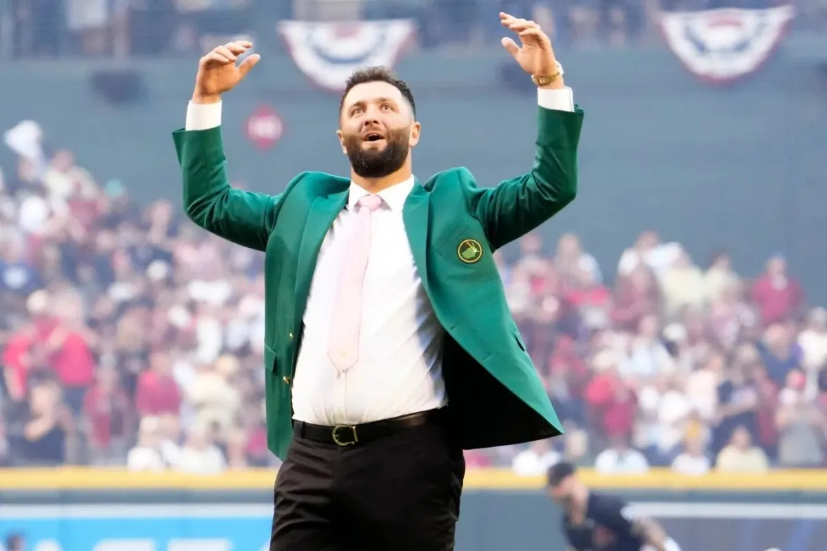 Spanish professional golfer and Arizona State University alumnus Jon Rahm reacts after throwing out the ceremonial first pitch before Game 4 of the World Series between the Arizona Diamondbacks and Texas Rangers at Chase Field in Phoenix on Oct. 31, 2023. (© Rob Schumacher/Arizona Republic/USA TODAY NETWORK via Field Level Media)