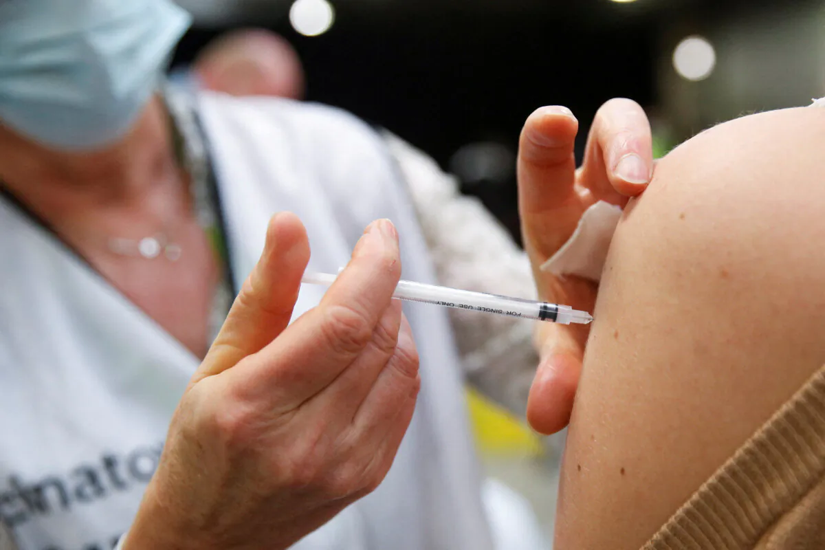 A woman receives a Moderna COVID-19 vaccine in a file photograph. (Johanna Geron/Reuters)