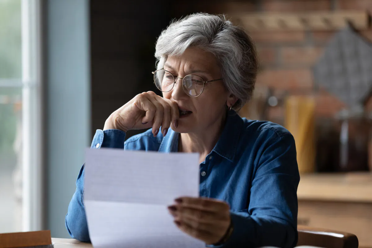 Your total monthly debt obligation shouldn't be more than 36 percent of your gross income. (fizkes/Shutterstock)