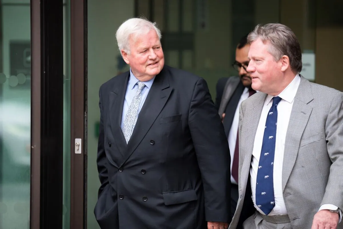 Conservative MP Bob Stewart (L) leaves Westminster Magistrates Court in central London on July 19, 2023. (PA)