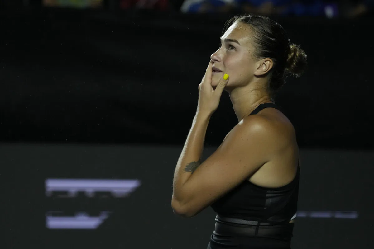 Aryna Sabalenka, of Belarus, reacts as it begins to rain during a women's singles match against Elena Rybakina, of Kazakhstan, at the WTA Finals tennis championships, in Cancun, Mexico, on Nov. 2, 2023. (Fernando Llano/AP Photo)