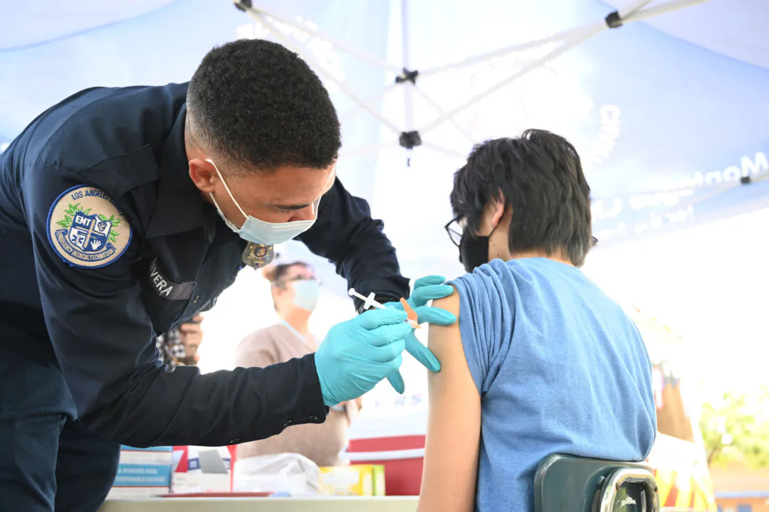 A person receies a COVID-19 vaccine in Los Angeles, Calif., on Aug. 23, 2021. (Robyn Beck/AFP via Getty Images)