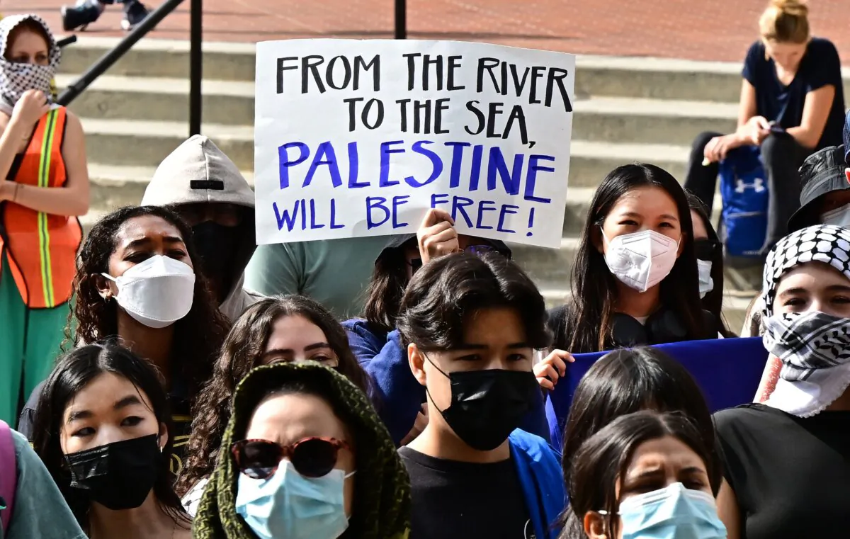 A participant holds a placard as students gather during a "Walkout to fight Genocide and Free Palestine" at Bruin Plaza at the University of California–Los Angeles on Oct. 25, 2023. (Frederic J. Brown/AFP via Getty Images)