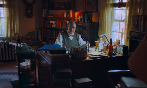Man at desk in an office in THE HOLDOVERS