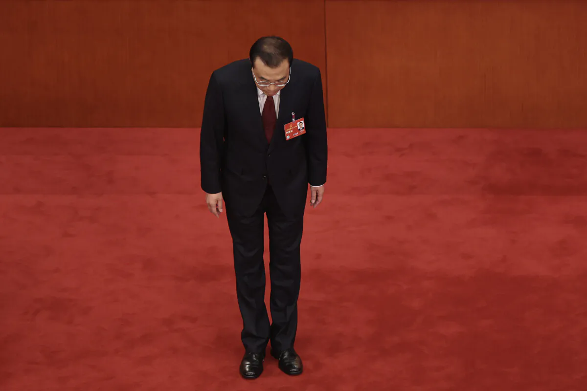 China's Premier Li Keqiang bows to delegates after delivering his work report during the opening of the first session of the 14th National People's Congress at The Great Hall of People in Beijing, on March 5, 2023.(Lintao Zhang/Getty Images)