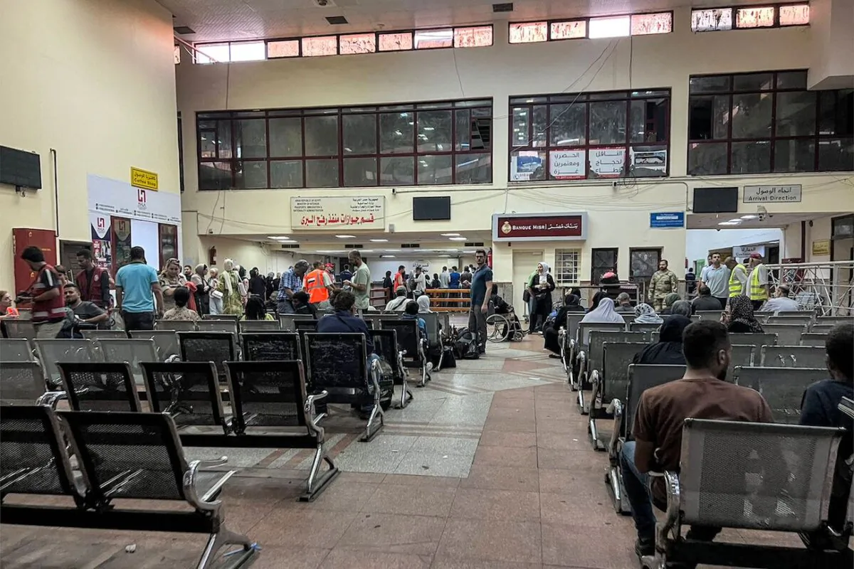 Foreigners and dual nationals who fled Gaza for Egypt wait to be processed at Egypt's Rafah border crossing with the Gaza Strip, on Nov. 2, 2023. (AFP via Getty Images)