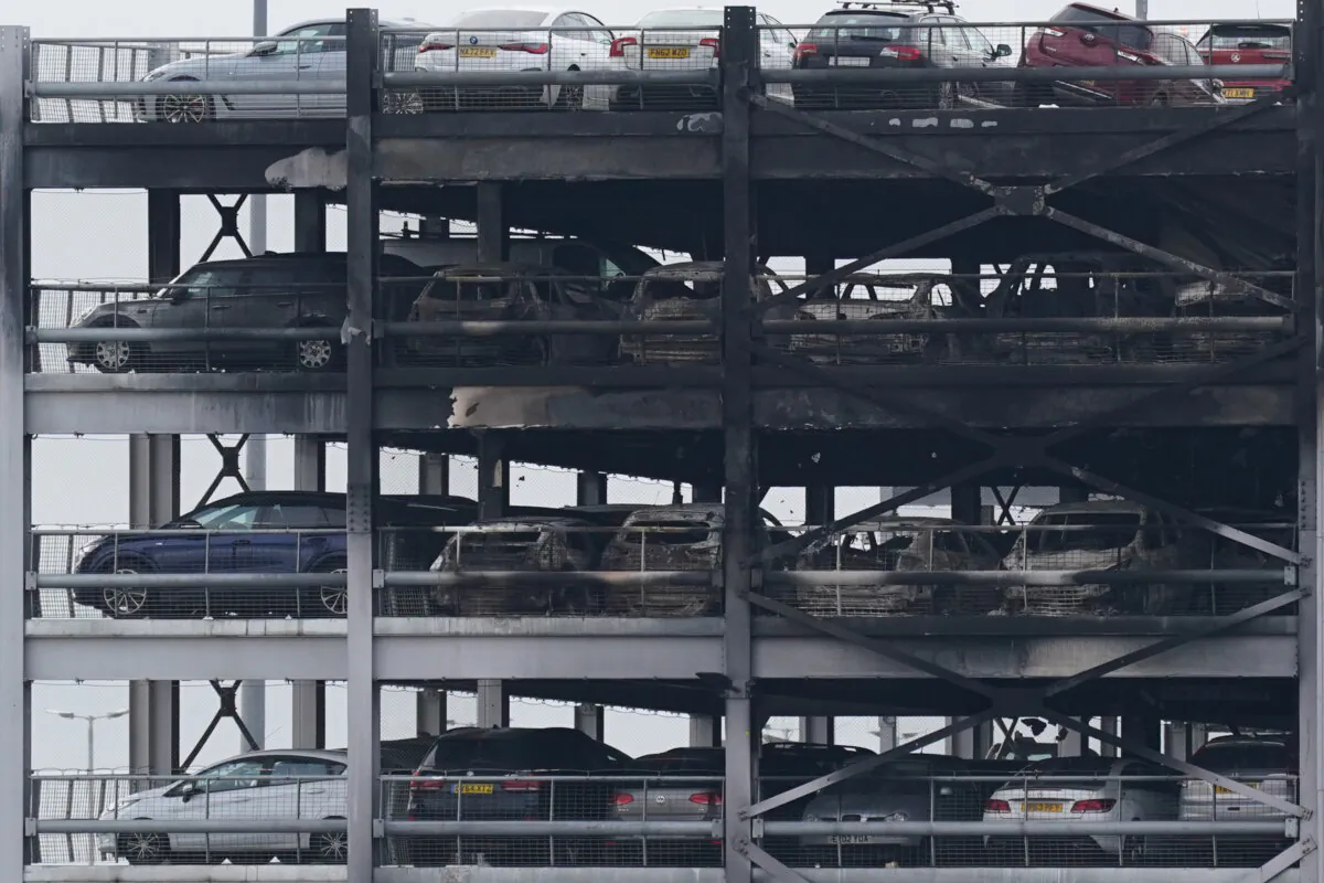 The burnt out shells of cars, buried amongst debris of a multi-storey car park at Luton Airport in Luton, Bedfordshire, England, on Oct. 11, 2023. (Jacob King/PA Wire)
