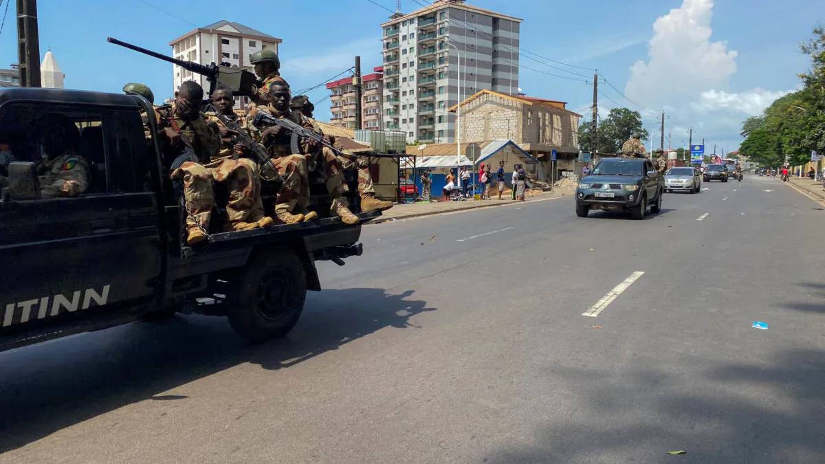 A convoy of Guinean security forces patrol a street, after former head of Guinea's 2008 military junta, Moussa Dadis Camara, was sprung from prison by heavily armed men in Conakry, in Conakry, Guinea, on Nov. 4, 2023. (Souleymane Camara/Reuters)