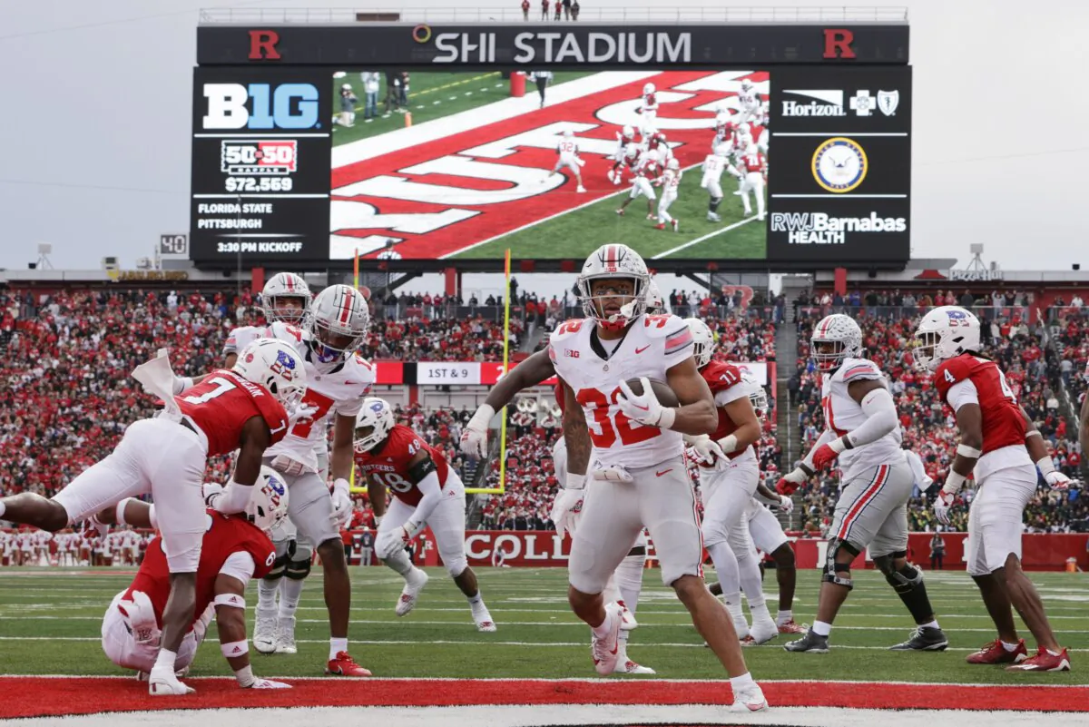 Running back TreVeyon Henderson (32) of the Ohio State Buckeyes scores a touchdown against the Rutgers Scarlet Knights during the third quarter of a college football game in Piscataway, New Jersey, on Nov. 4, 2023. (Rich Schultz/Getty Images)