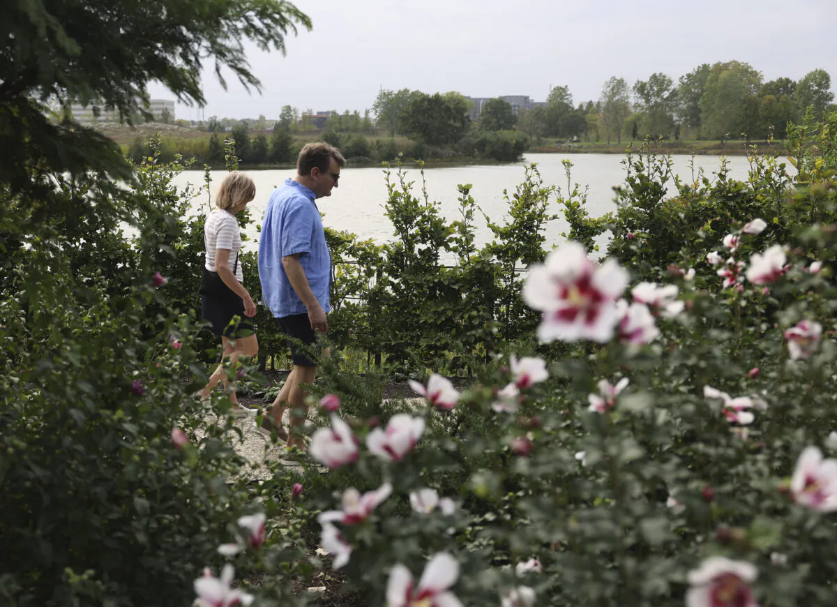 Visitors walk through the the Mitsuzo and Kyoko Shida Evaluation Garden at the Chicago Botanic Garden in Glencoe, Illinois on Oct. 4, 2023. (Trent Sprague/Chicago Tribune/TNS)