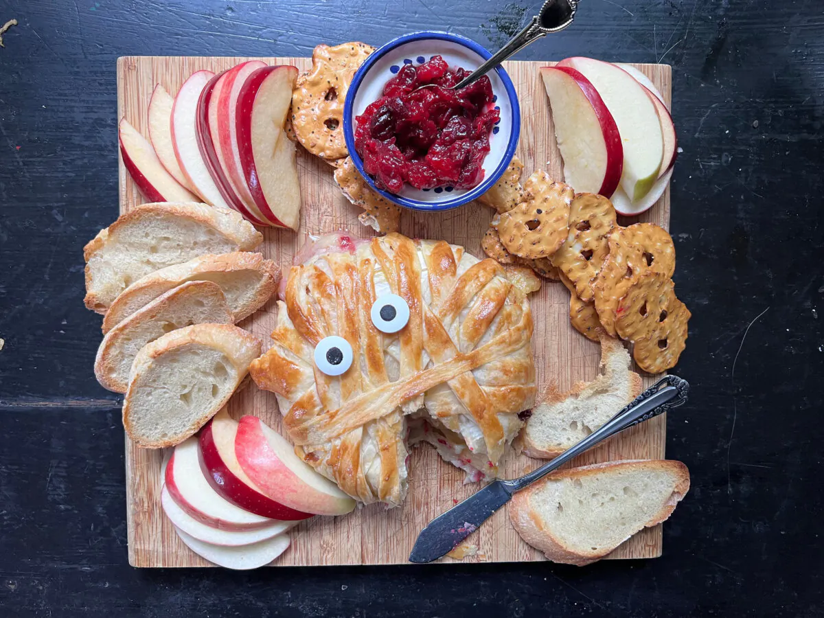 A "mummy" wrapped baked brie with homemade cranberry jam is the perfect Halloween appetizer. (Gretchen McKay/Pittsburgh Post-Gazette/TNS)