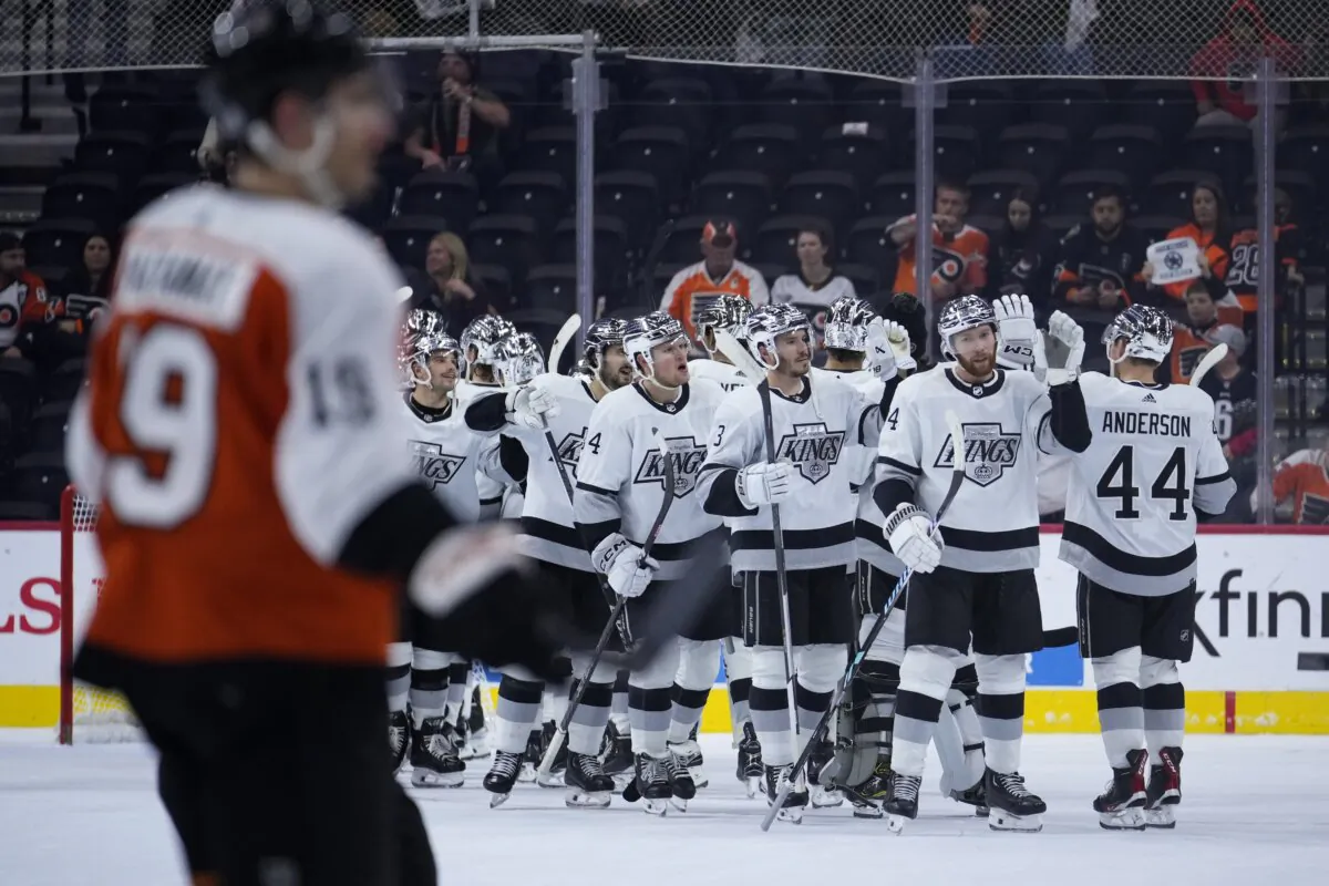 Los Angeles Kings' players celebrate past Philadelphia Flyers' Garnet Hathaway after wining an NHL hockey game in Philadelphia on Nov. 4, 2023. (Matt Slocum/AP Photo)