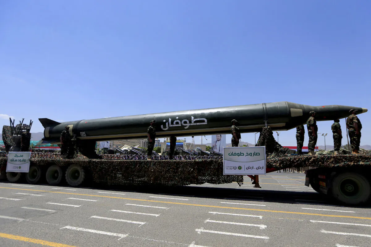 Houthi soldiers stand guard on a missile carrier during an official military parade marking the ninth anniversary of the takeover of the capital, Sanaa, on Sept. 21, 2023. (MOHAMMED HUWAIS/AFP via Getty Images)