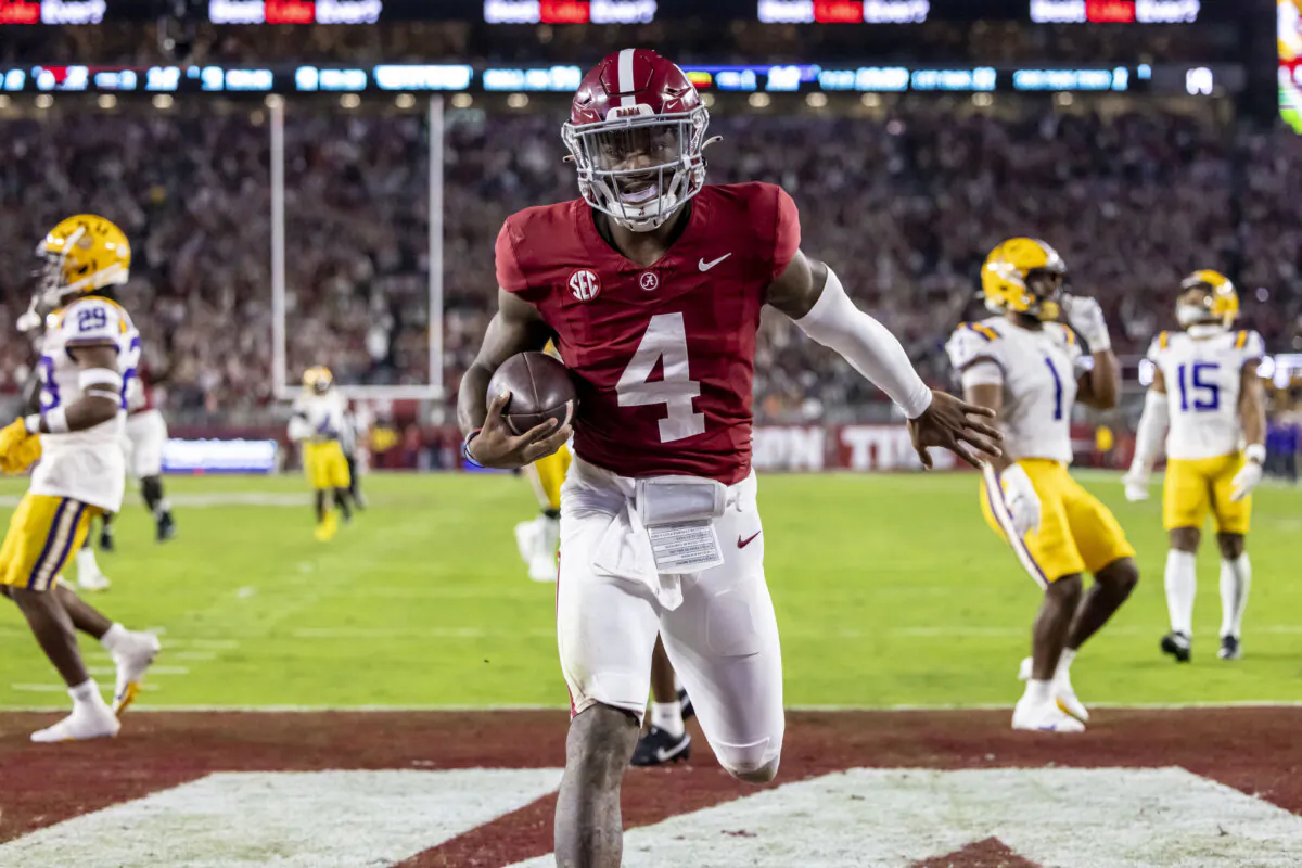 Alabama quarterback Jalen Milroe scores a running touchdown against LSU during the first half of an NCAA college football game in Tuscaloosa, Ala., on Nov. 4, 2023. (Vasha Hunt/AP Photo)