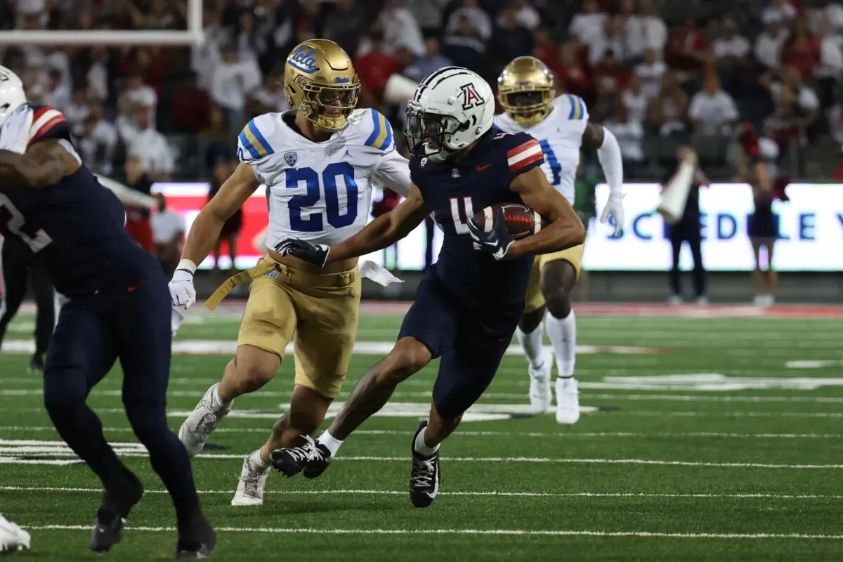 Arizona Wildcats wide receiver Tetairoa McMillan (4) makes a catch for a first down against UCLA Bruins linebacker Kain Medrano (20) during the first half at Arizona Stadium in Tucson, Ariz., on Nov. 4, 2023. (Zachary BonDurant/USA TODAY Sports via Field Level Media)