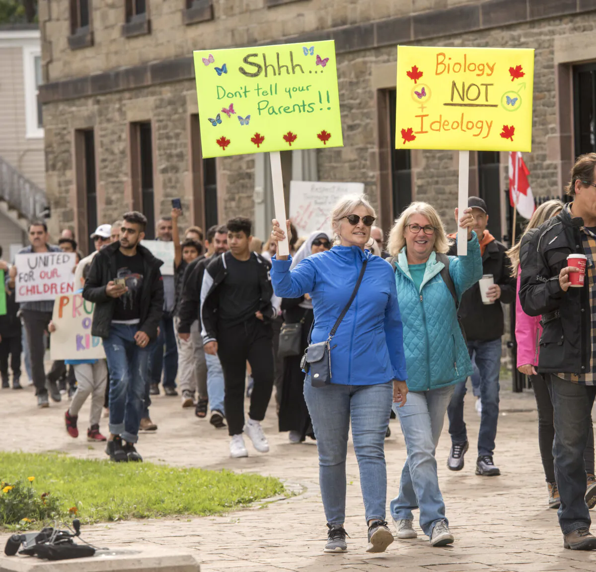 People opposed to the teaching of gender ideology in schools participate in a march on the grounds of the New Brunswick legislature in Fredericton on Sept. 20, 2023. (The Canadian Press/Stephen MacGillivray)