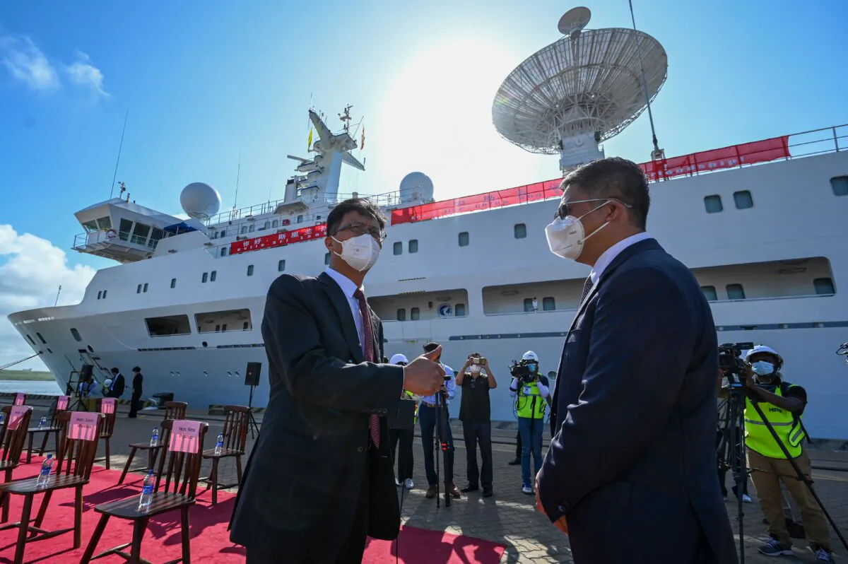 Chinese Ambassador to Sri Lanka Qi Zhenhong (L) gestures upon the arrival of China's research and survey vessel, the Yuan Wang 5, at Hambantota Port on Aug. 16, 2022. (Ishara S. Kodikara/AFP via Getty Images)