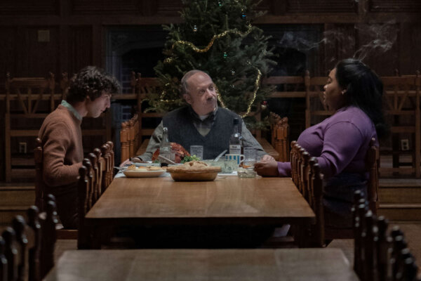 Angus Tully (Dominic Sessa), Paul Hunham (Paul Giamatti), and Mary Lamb (Da’Vine Joy Randolph) remain at school during Christmas break, in director Alexander Payne’s “The Holdovers.'