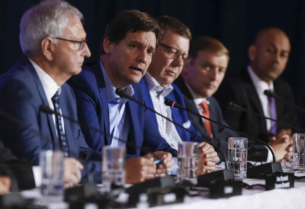 B.C. Premier David Eby (2nd L) speaks to media during the closing news conference at the Council of the Federation Canadian premiers meeting at The Fort Garry Hotel in Winnipeg, on July 12, 2023. (The Canadian Press/John Woods)