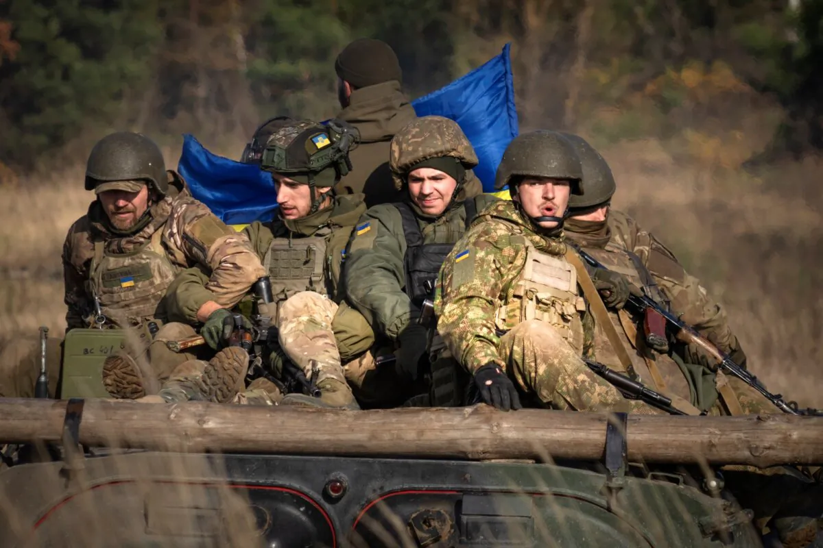 A soldier of the Ukraine's National Guard 1st brigade Bureviy (Hurricane) ride an APC during combat training at a military training ground in the north of Ukraine on Nov. 3, 2023. (AP Photo/Efrem Lukatsky)