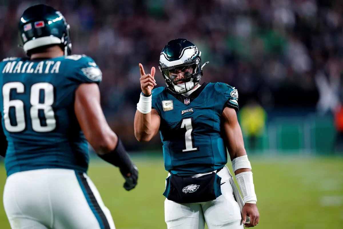 Philadelphia Eagles quarterback Jalen Hurts (1) reacts to his touchdown pass to Eagles' A.J. Brown (11) during the second half of an NFL football game against the Dallas Cowboys in Philadelphia on Nov. 5, 2023. (Chris Szagola/AP Photo)