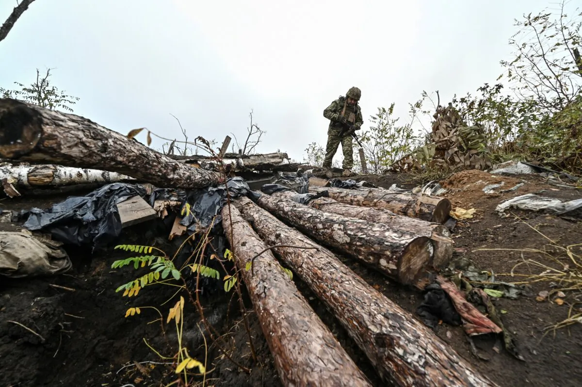 A Ukrainian serviceman inspects a former Russian position outside the village of Robotyne near a front line in Zaporizhzhia region, Ukraine, on Nov. 4, 2023. (Stringer/Reuters)