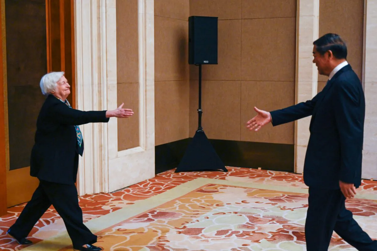 U.S. Treasury Secretary Janet Yellen (L) shakes hands with Chinese Vice Premier He Lifeng during a meeting at the Diaoyutai State Guesthouse in Beijing on July 8, 2023. (Pedro Pardo/Pool/AFP via Getty Images)