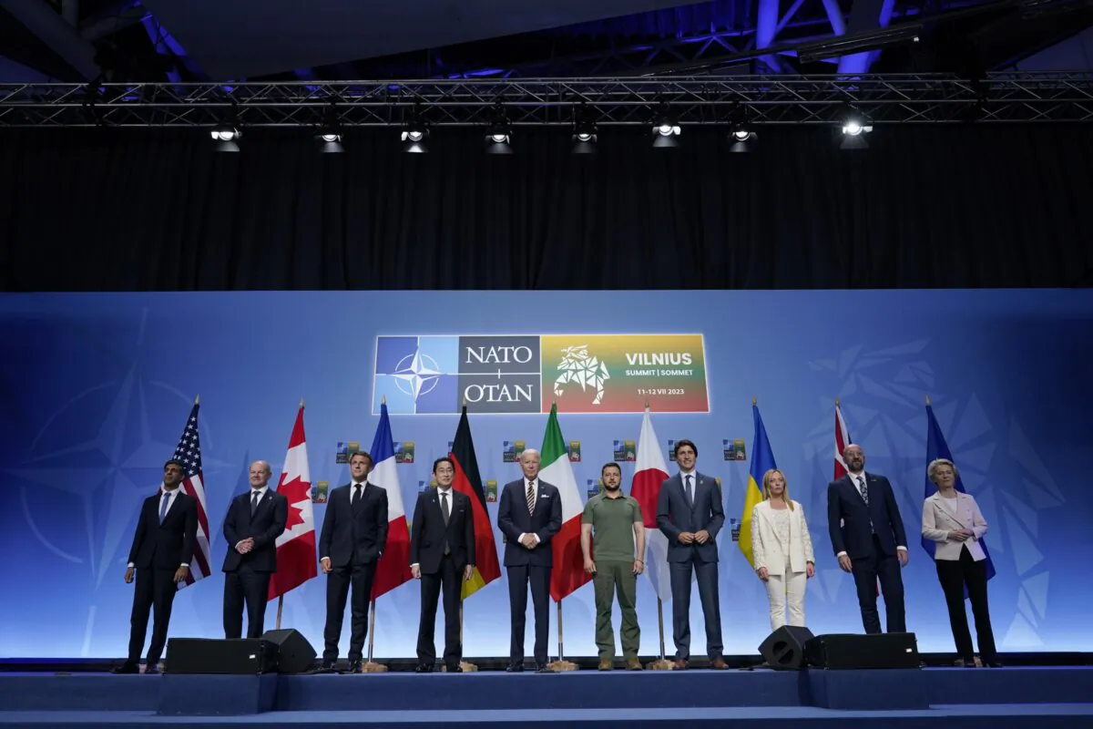 From left, Britain's Prime Minister Rishi Sunak, German Chancellor Olaf Scholz, French President Emmanuel Macron, Japan's Prime Minster Fumio Kishida, U.S. President Joe Biden, Ukrainian President Volodymyr Zelensky, Canada's Prime Minister Justin Trudeau, Italy's Prime Minister Giorgia Meloni, European Council President Charles Michel, and European Commission President Ursula von der Leyen at an event to announce a Joint Declaration of Support for Ukraine during the NATO Summit, in Vilnius, Lithuania, on July 12, 2023. (Susan Walsh/AP Photo)