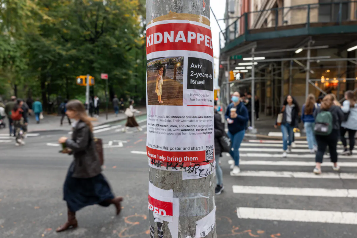 Posters of some Israeli children kidnapped by Hamas into Gaza are displayed on a pole outside of New York University on Oct. 30, 2023. (Spencer Platt/Getty Images)