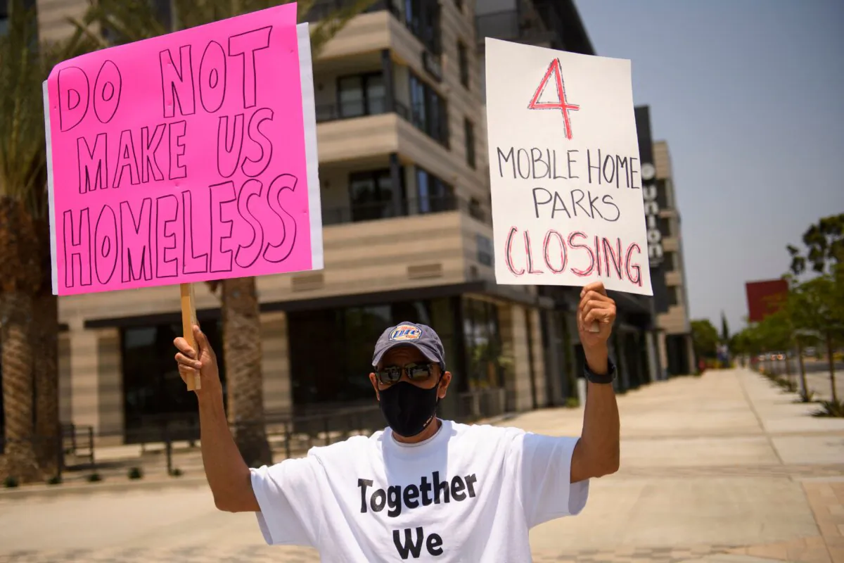 Mobile home residents and their supporters protest outside of Carson City Hall in Carson, Calif., on July 15, 2021. (Patrick T. Fallon/AFP via Getty Images)