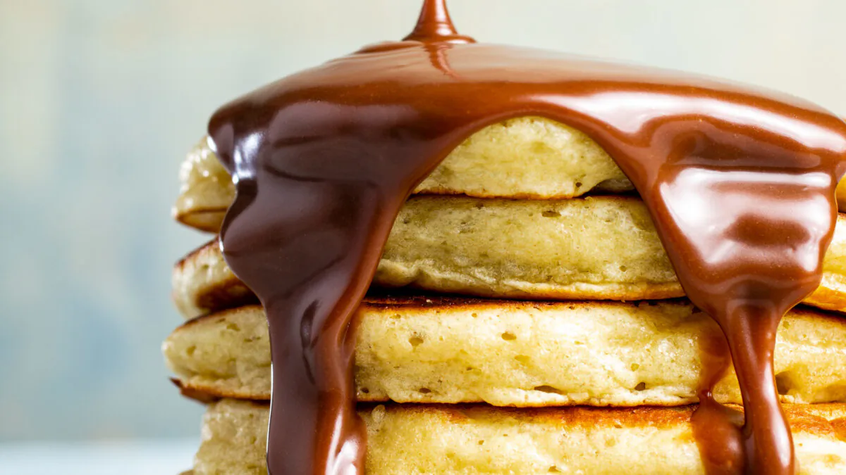 A decadent chocolate-hazelnut syrup takes your pancakes to the next level. (Steve Klise/TNS)