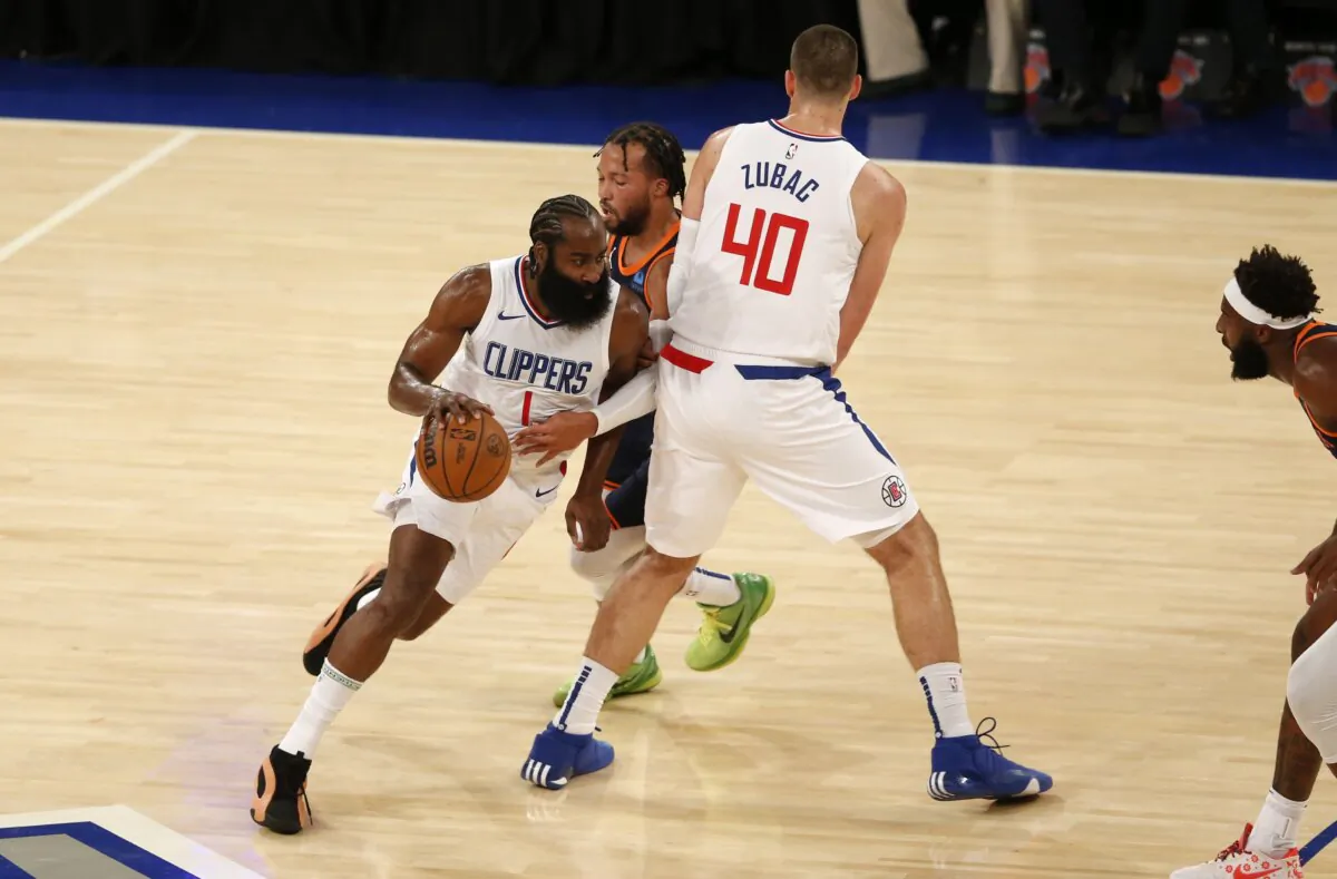 Los Angeles Clippers guard James Harden dribbles around teammate Ivica Zubac (40) and New York Knicks guard Jalen Brunson during the first half of an NBA basketball game in New York Nov. 6, 2023. (John Munson/AP Photo)