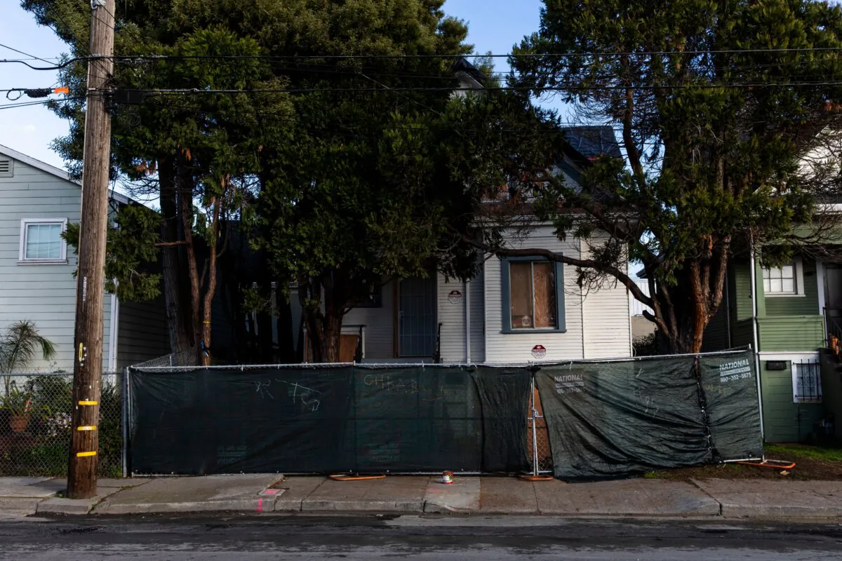 A fence blocks the front of a home in Oakland, Calif., on Jan. 28, 2020. (Philip Pacheco/AFP via Getty Images)