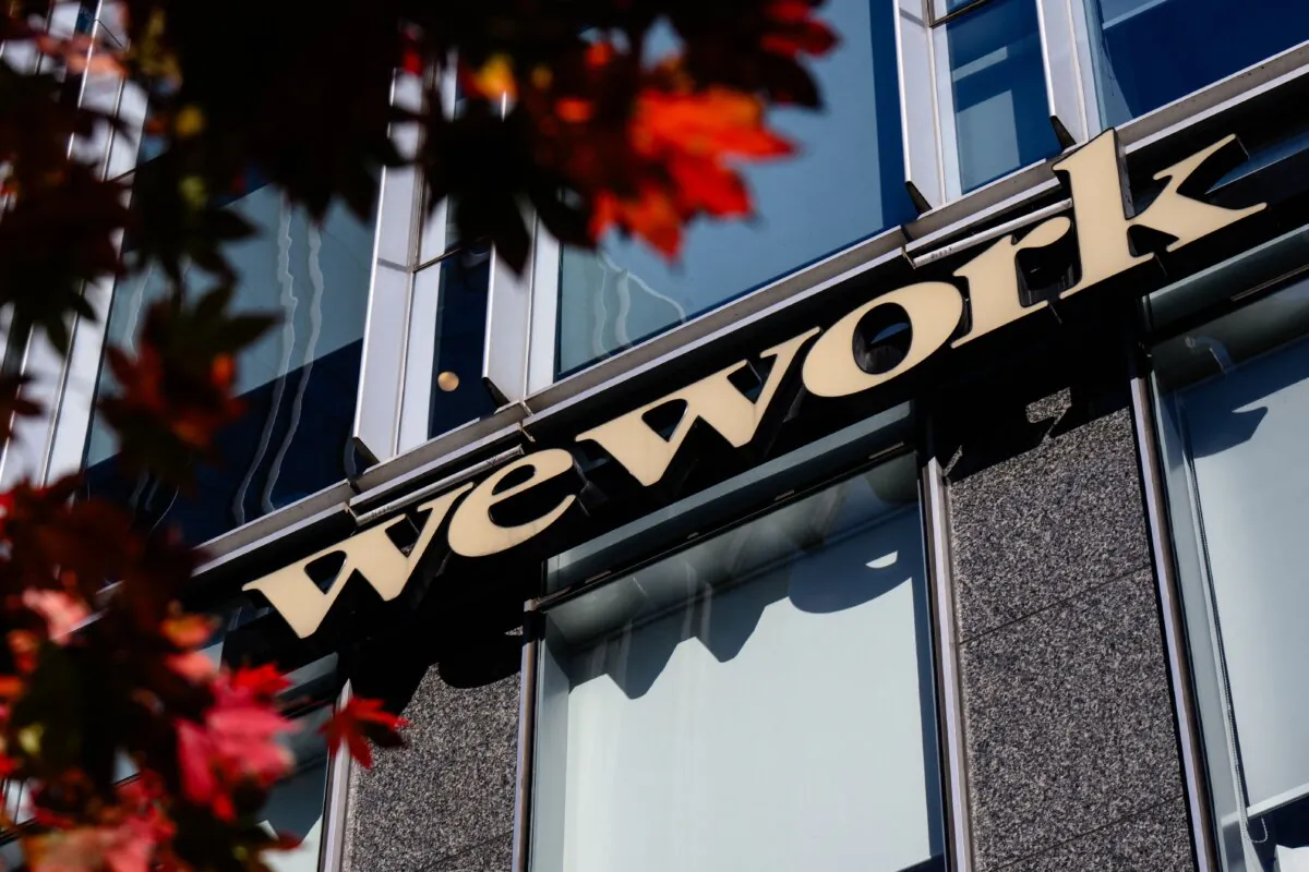 Signage for shared office giant WeWork is seen outside a building in Seoul on Nov. 7, 2023. (ANTHONY WALLACE/AFP via Getty Images)