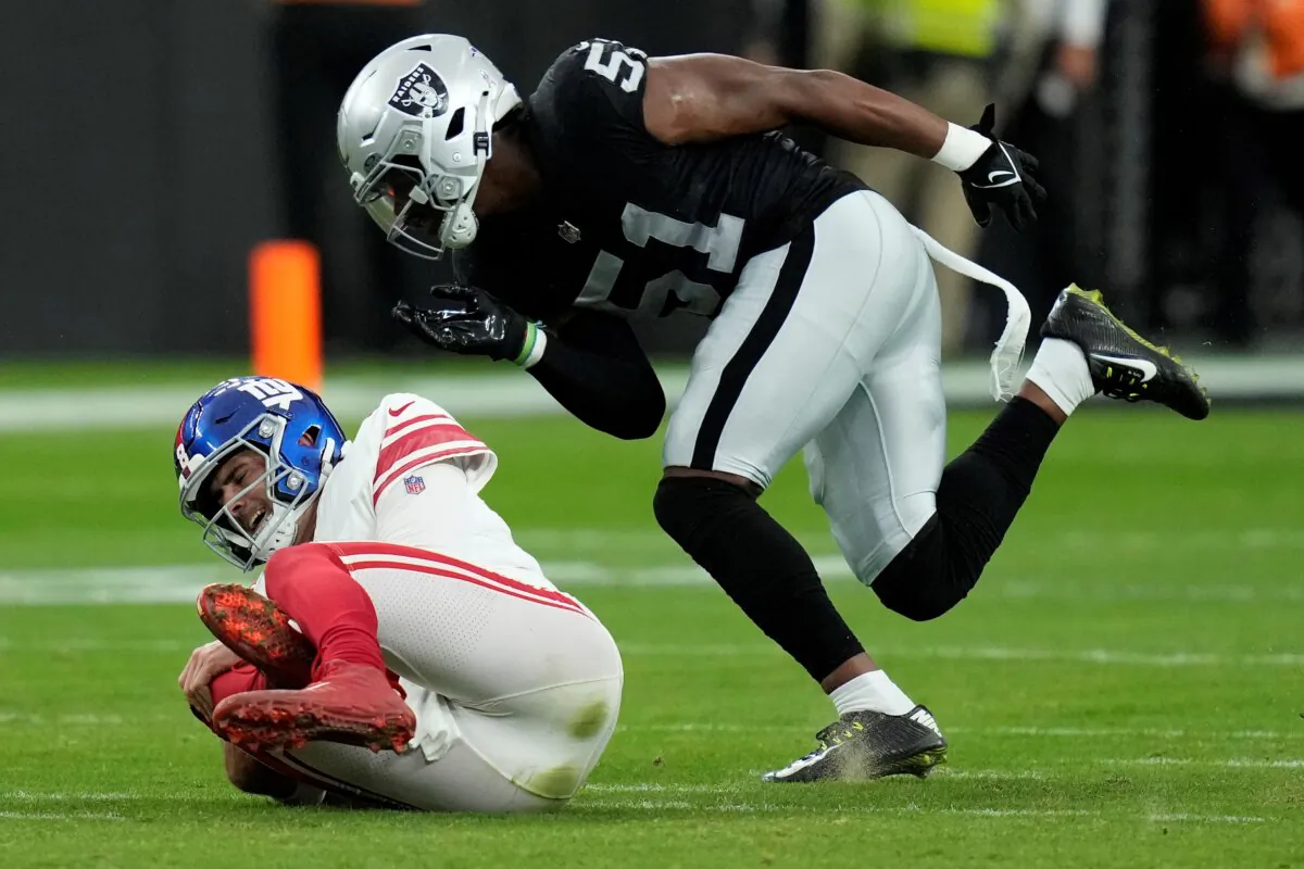 New York Giants quarterback Daniel Jones grimaces after a sack during the first half of an NFL football game against the Las Vegas Raiders, in Las Vegas on Nov. 5, 2023. (John Locher/AP Photo)