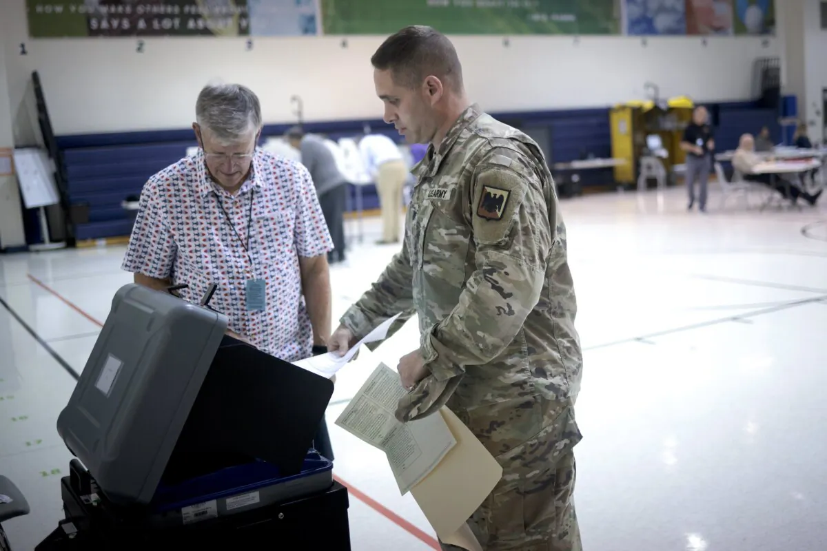 Virginia voters submit their ballots at Newton-Lee Elementary School in Ashburn, Va., on Nov. 7, 2023. (Win McNamee/Getty Images)