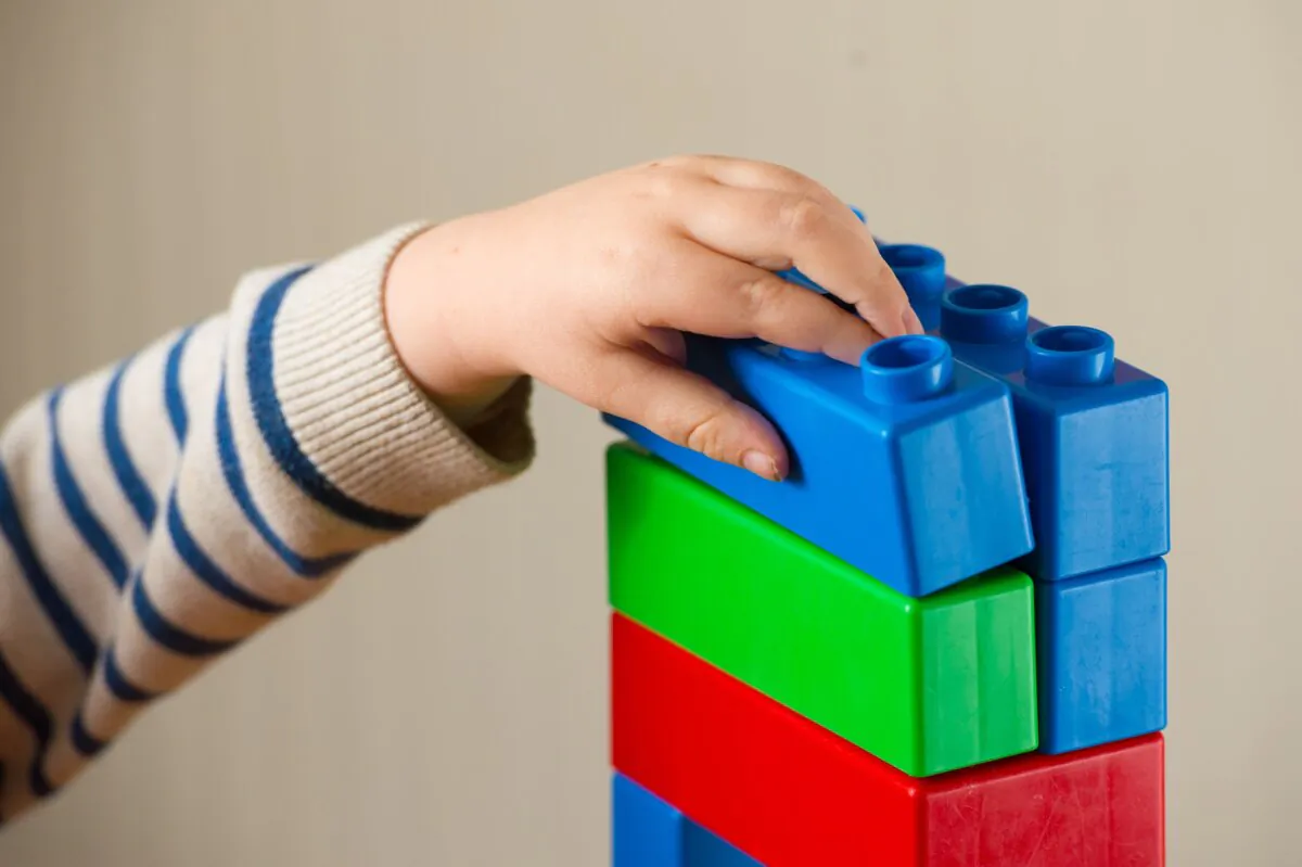 Undated photo of a child playing with plastic building blocks. (PA)