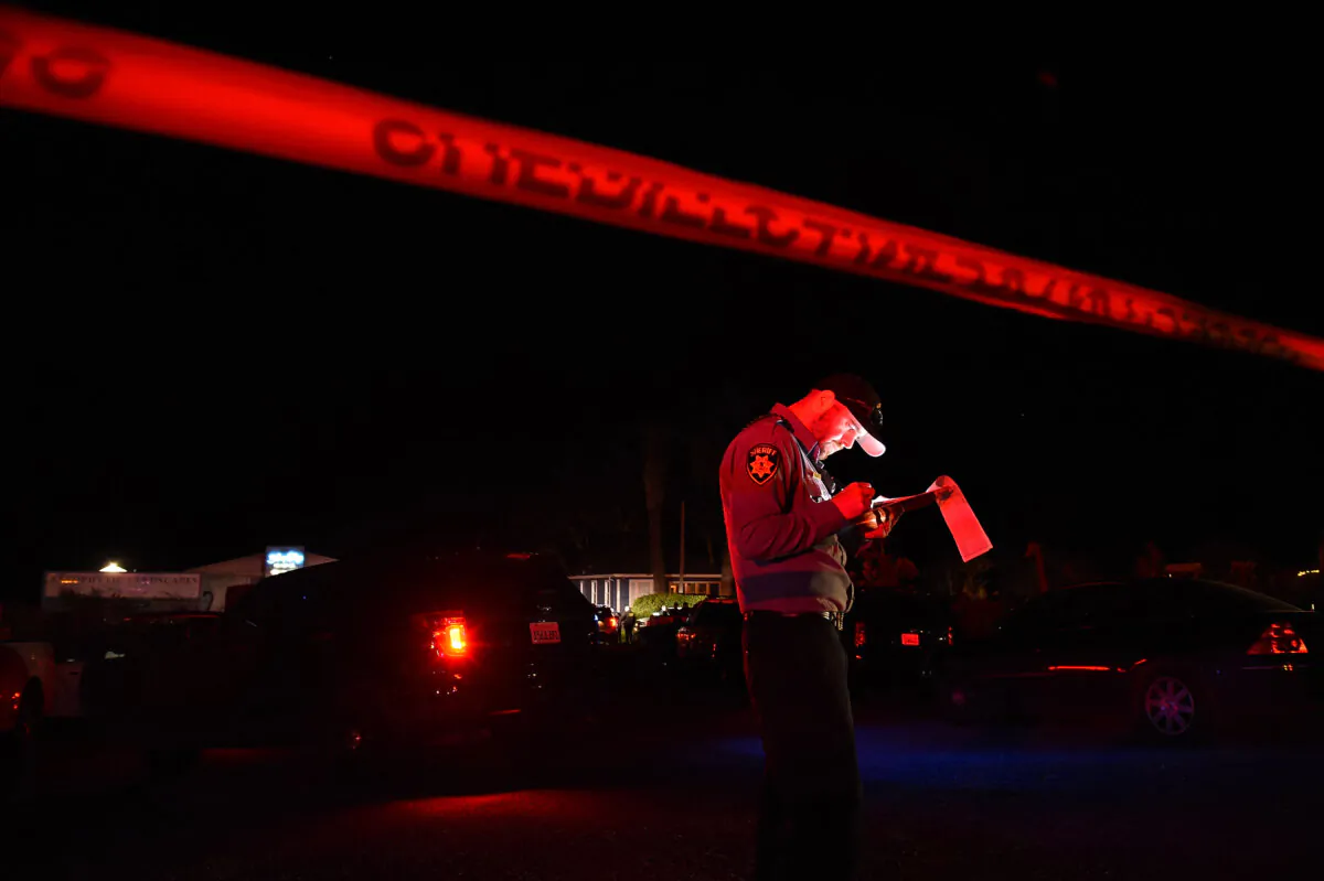 A sheriff deputy stands at the scene of a shooting in a file image. (Susana Bates/AFP via Getty Images)