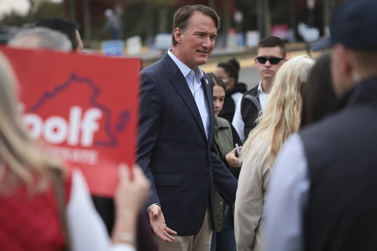 Virginia Gov. Glenn Youngkin greets voters while campaigning at Piney Branch Elementary School in Bristow, Va., on Nov. 7, 2023. (Win McNamee/Getty Images)