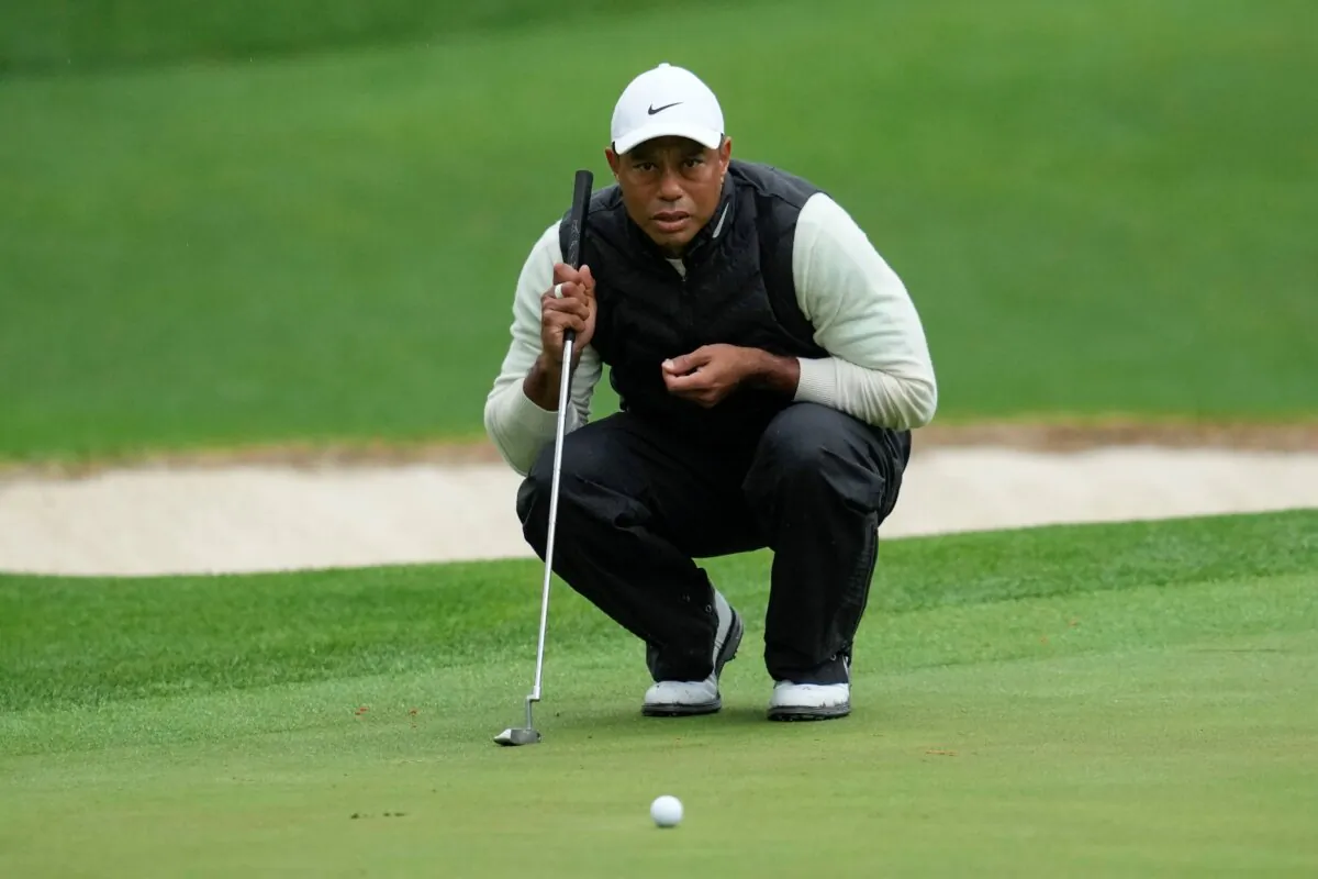 Tiger Woods lines up a putt on the 16th hole during the weather delayed second round of the Masters golf tournament at Augusta National Golf Club in Augusta, Ga., on April 8, 2023. (Mark Baker/AP Photo)