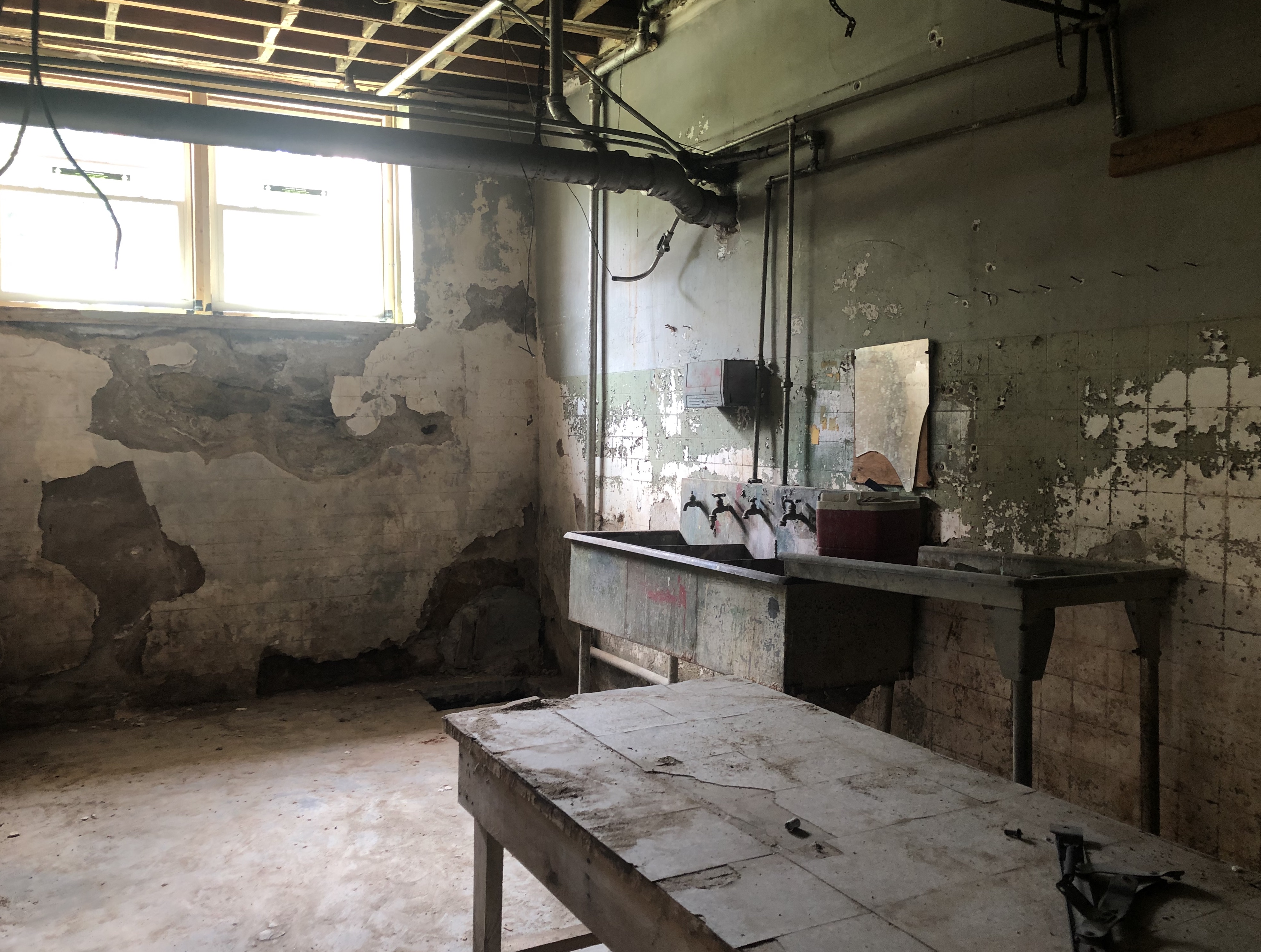 The bedroom in one of the units before the transformation of the schoolhouse.