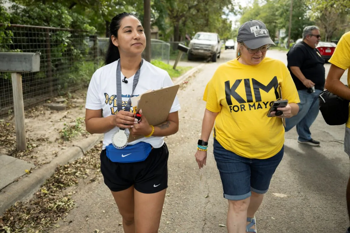 Uvalde mayoral candidate Kimberly Mata-Rubio (L) and campaign manager Dr. Laura Barberena, canvass a Uvalde, Texas neighborhood on Oct. 21, 2023. (AP Photo/Darren Abate)