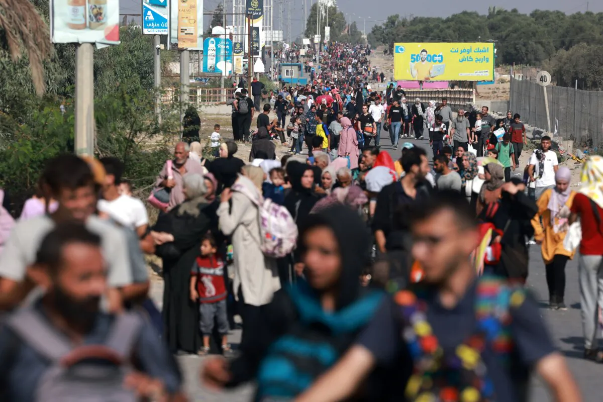 Palestinians fleeing Gaza City and other parts of northern Gaza towards the southern areas, walk on a road on Nov. 8, 2023. (Mohammed Abed/AFP via Getty Images)