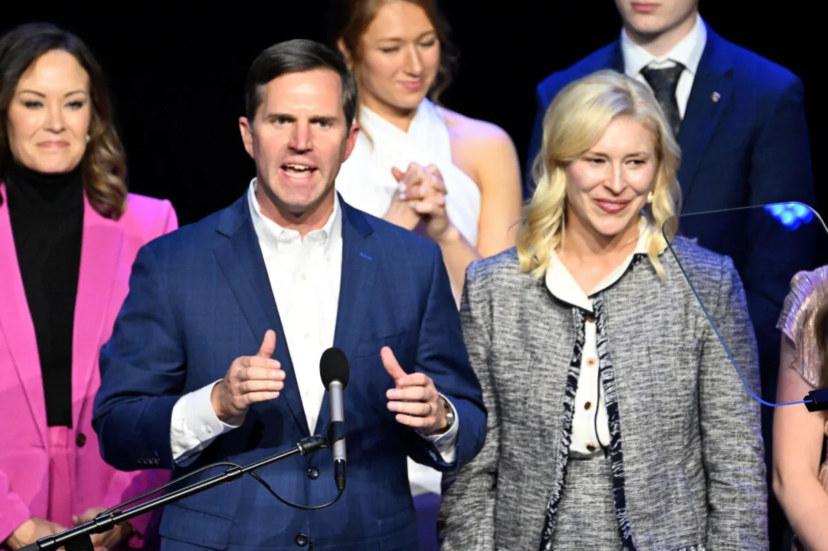 Kentucky incumbent Democratic Gov. Andy Beshear is joined by his wife, Britainy Beshear (R) as he delivers his victory speech to a crowd at an election night event at Old Forrester's Paristown Hall in Louisville, Ky., on Nov. 7, 2023. (Stephen Cohen/Getty Images)