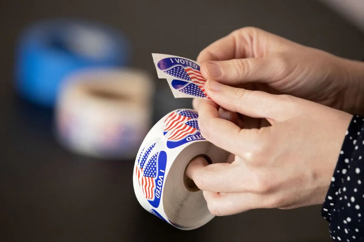 Election workers hand out "I Voted" stickers at the VCU Institute for Contemporary Art on Election Day in Richmond, Va., on Nov. 8, 2022. (Ryan M. Kelly/AFP/Getty Images)