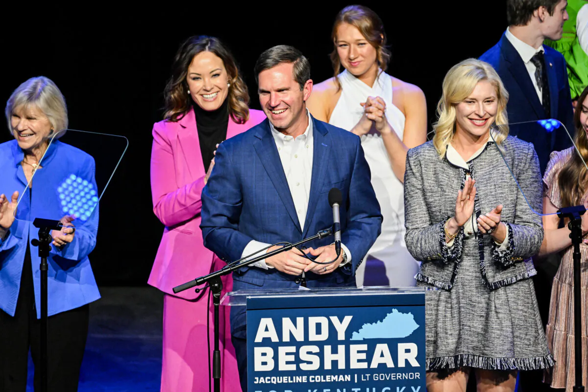 Kentucky incumbent Democratic Gov. Andy Beshear is joined by his wife, Britainy Beshear (R), Kentucky Lt. Gov. Jacqueline Coleman (C-L) and his family as he delivers his victory speech to a crowd at an election night event at Old Forrester's Paristown Hall on Nov. 7, 2023, in Louisville, Ky. (Photo by Stephen Cohen/Getty Images)
