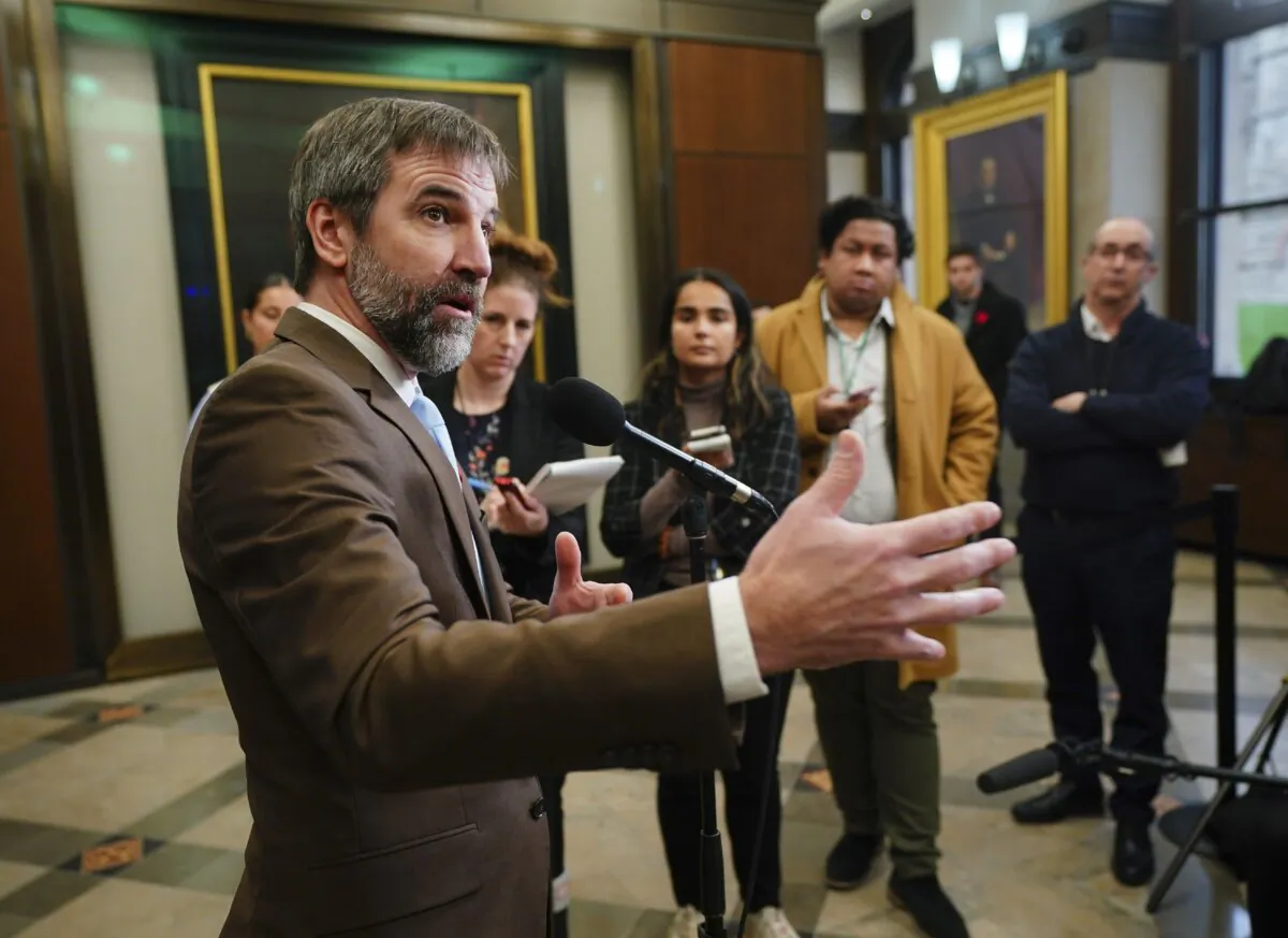Environment Minister Steven Guilbeault speaks to reporters in the foyer of the House of Commons on Nov. 7, 2023. (The Canadian Press/Sean Kilpatrick)