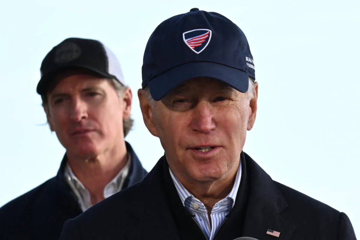 U.S. President Joe Biden speaks as California Gov. Gavin Newsom looks on after looking at storm damage and speaking to those affected in Seacliff, Calif., on Jan. 19, 2023. (Andrew Caballero-Reynolds/AFP via Getty Images)